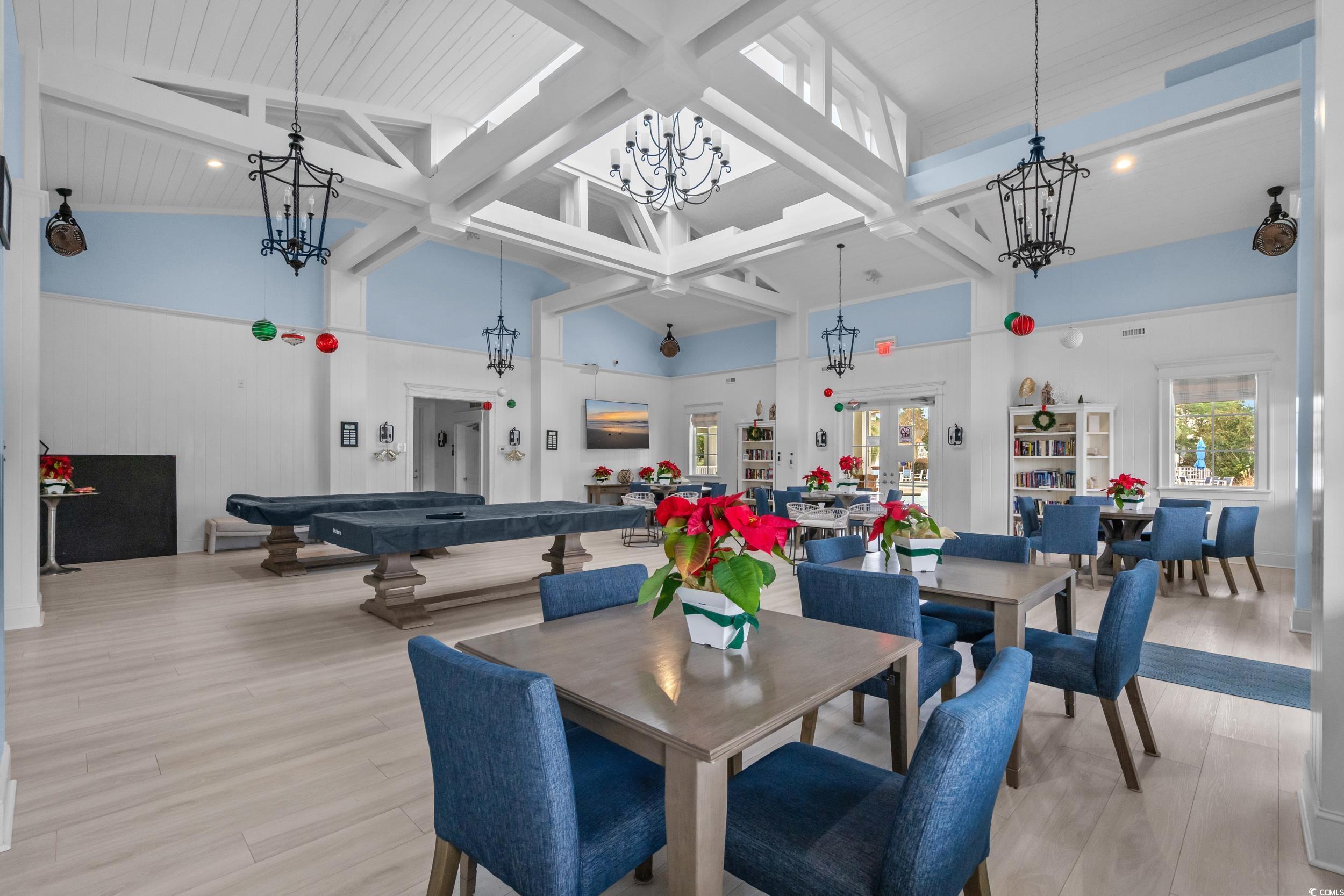 2908 Moss Bridge Lane Myrtle Beach, SC 29579 - Photo 18 of 35 Dining area with wood finished floors, a high ceiling, and a wooden ceiling with exposed beams