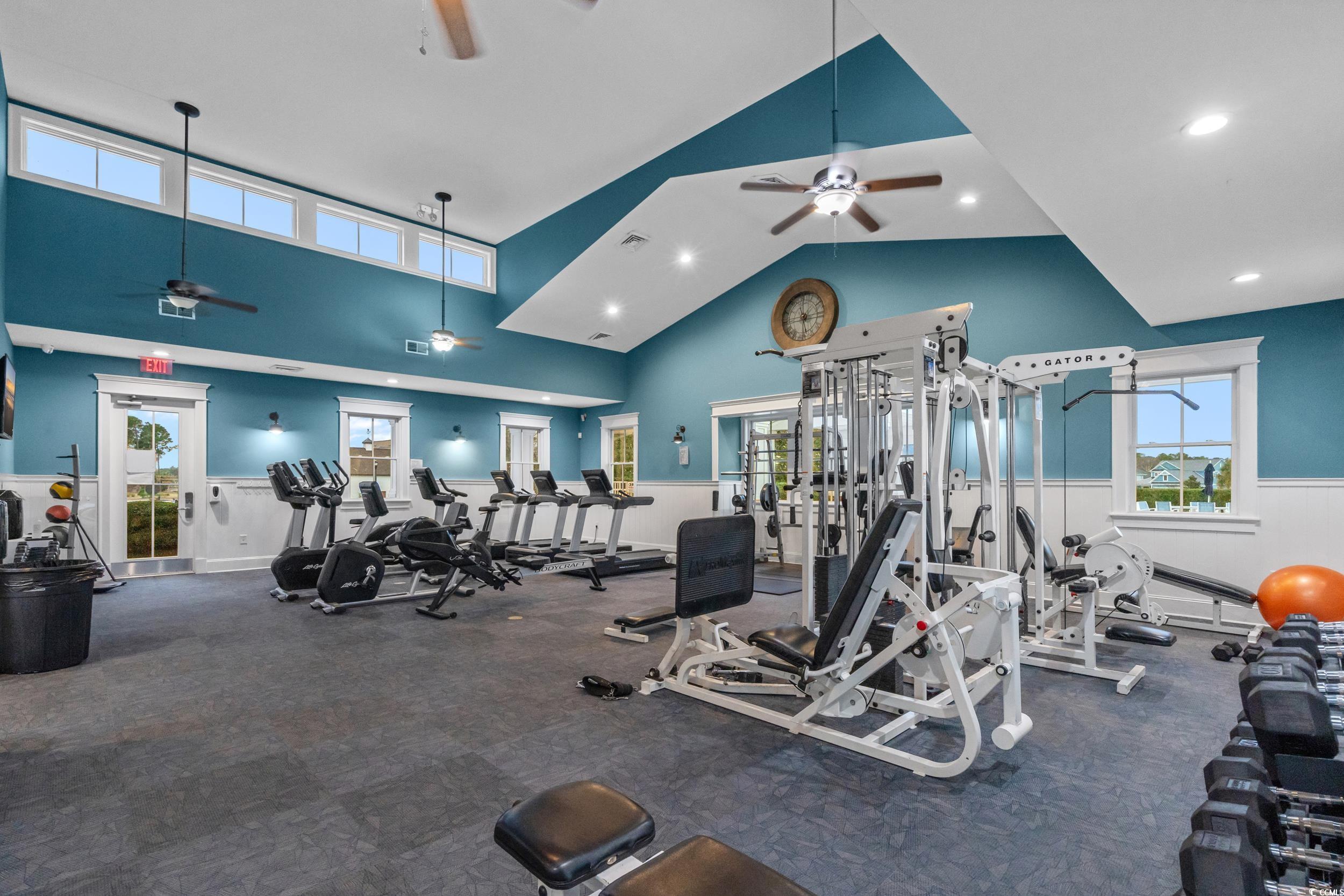 2908 Moss Bridge Lane Myrtle Beach, SC 29579 - Photo 19 of 35 Workout area with a wainscoted wall, a ceiling fan, recessed lighting, and vaulted ceiling