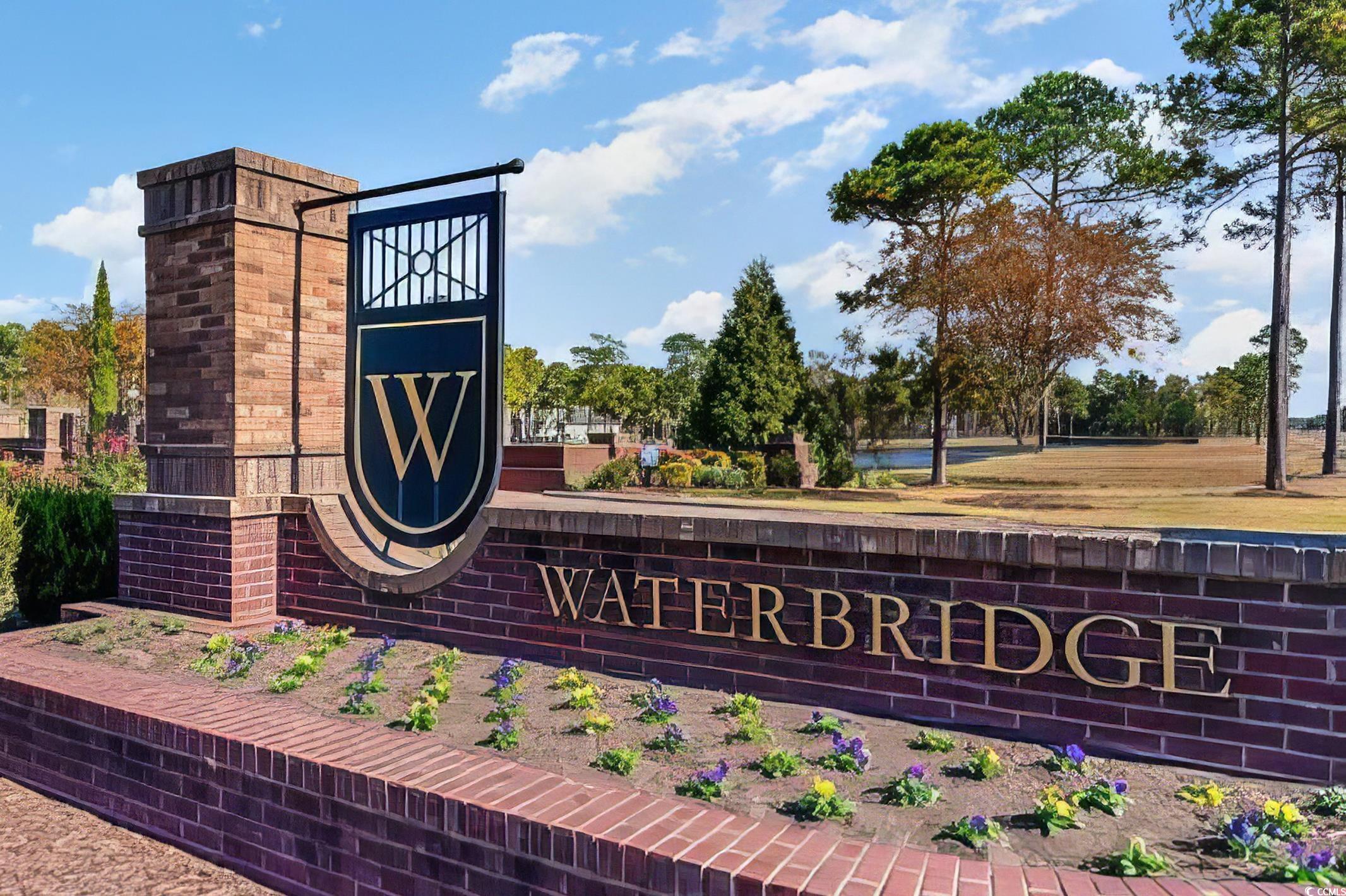 2908 Moss Bridge Lane Myrtle Beach, SC 29579 - Photo 34 of 35 Community sign with a water view