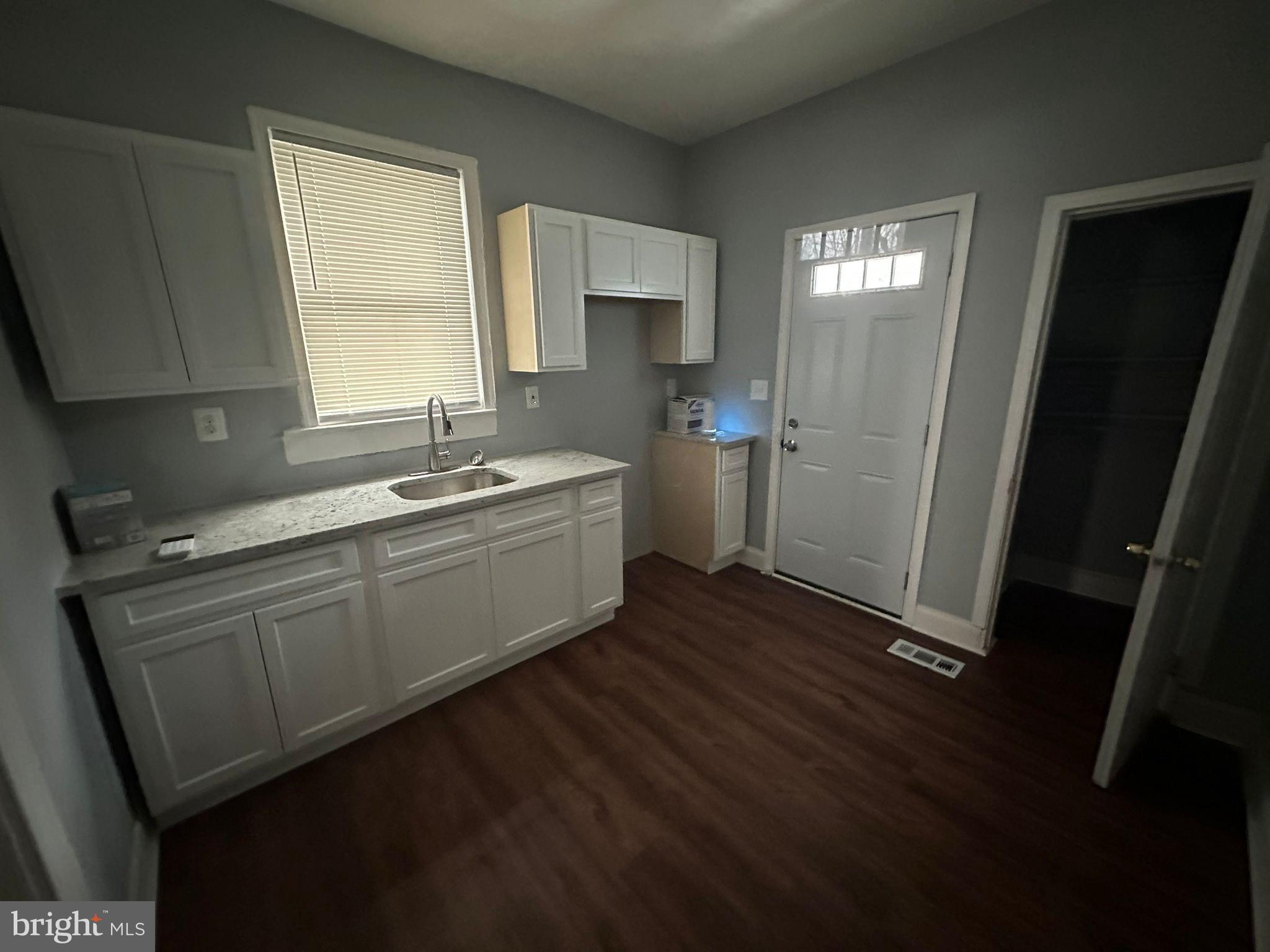 2806 Violet Avenue Baltimore, MD 21215 - Photo 9 of 10 a room with sink washer and dryer