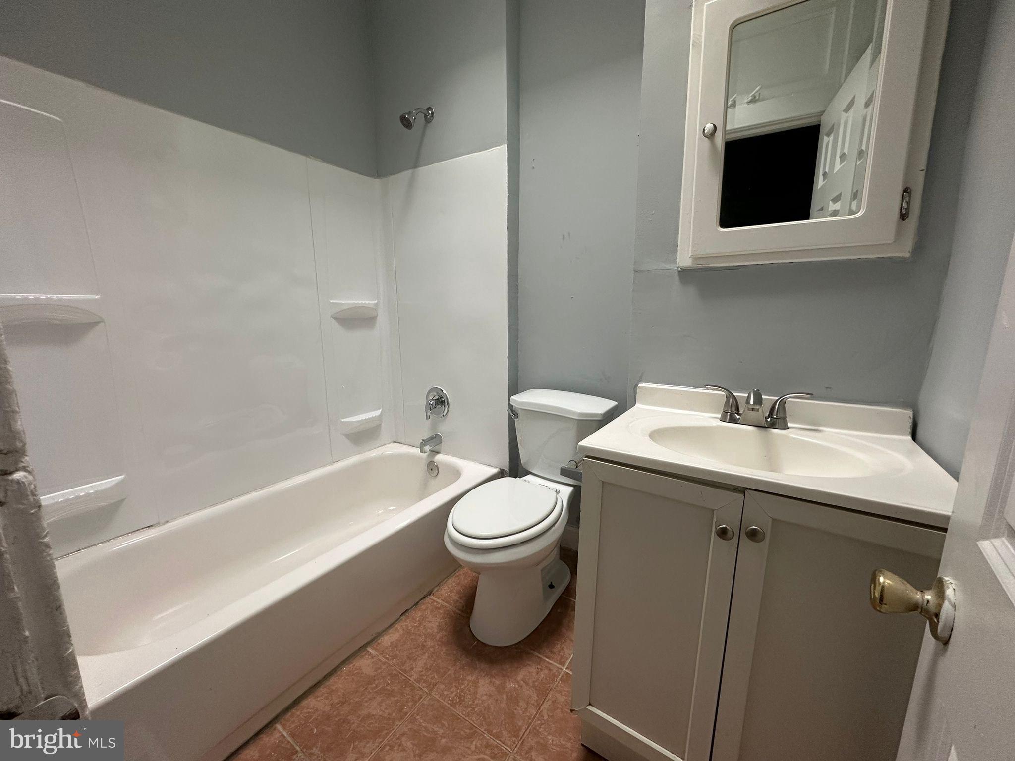 2806 Violet Avenue Baltimore, MD 21215 - Photo 10 of 10 a bathroom with a sink toilet and bathtub