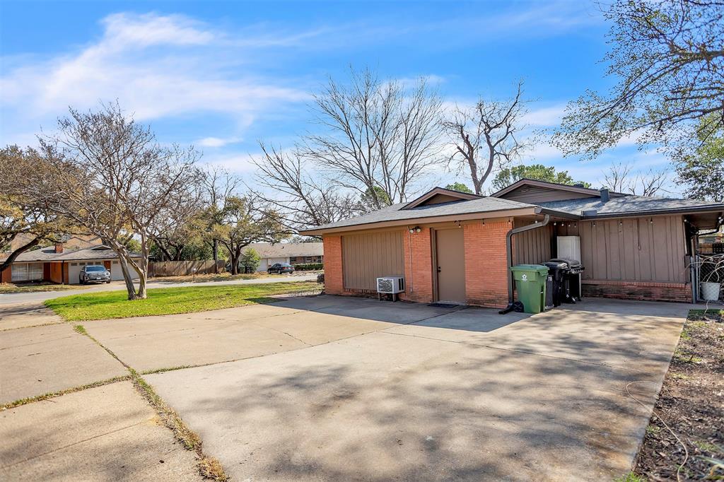709 Hurstview Drive Hurst, TX 76053 - Photo 26 of 28 a view of a house with a yard and large tree