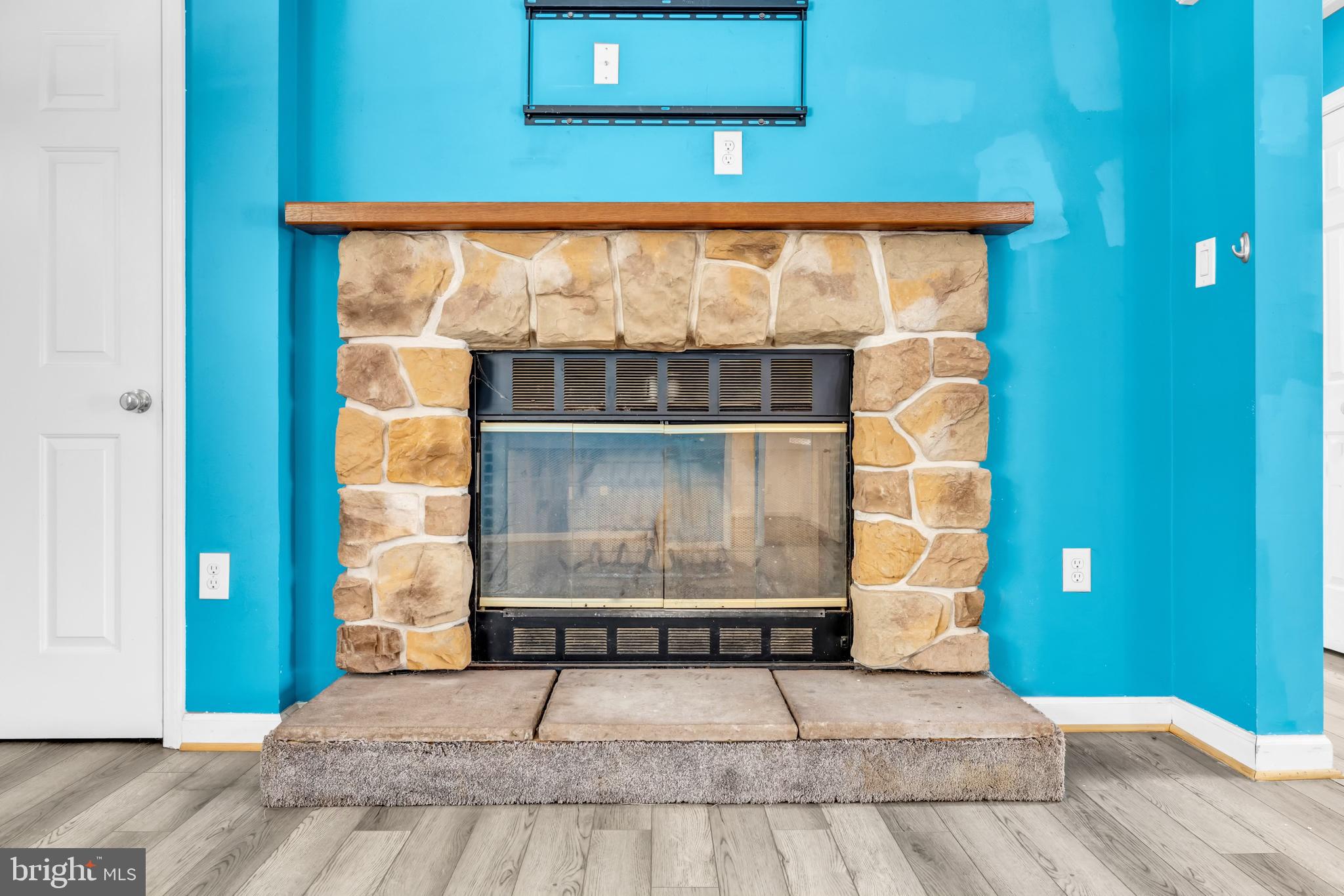 7392 Todds Wharf Road Preston, MD 21655 - Photo 11 of 63 Gorgeous fireplace with wooden mantle /block hearh