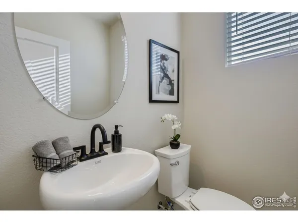 a bathroom with a sink a mirror and a shower