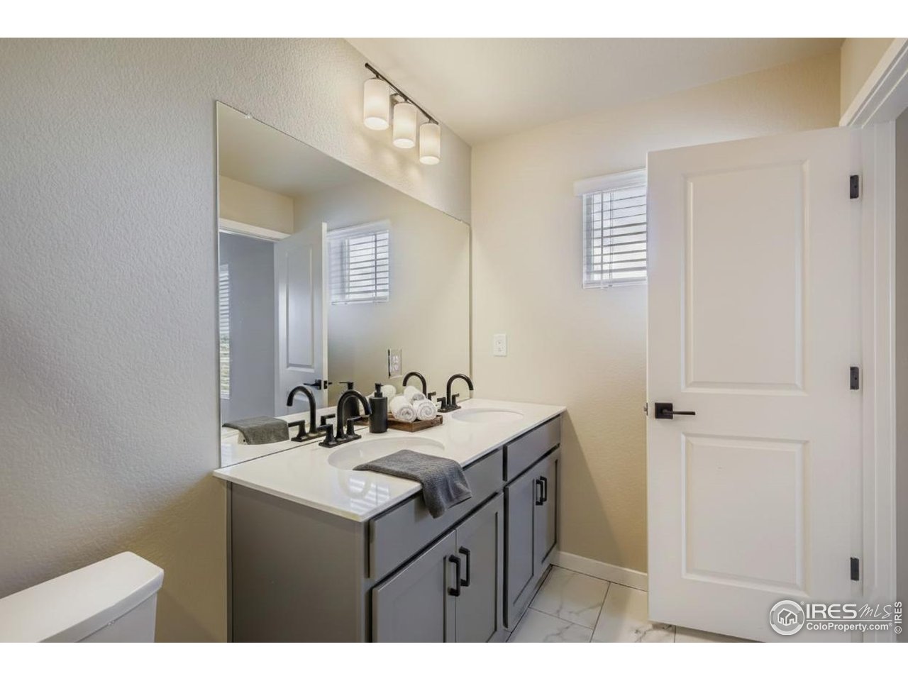 2297 East Suniga Road Fort Collins, CO 80524 - Photo 6 of 27 Dual vanities in the primary bathroom