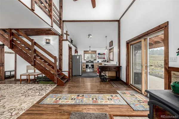 a living room with lots of furniture and a rug
