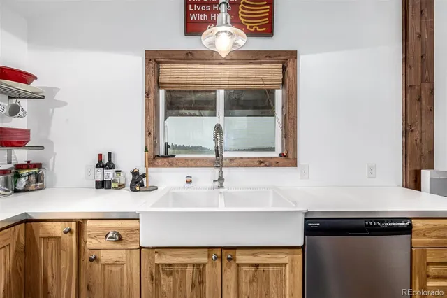 a kitchen with a sink and a cabinets