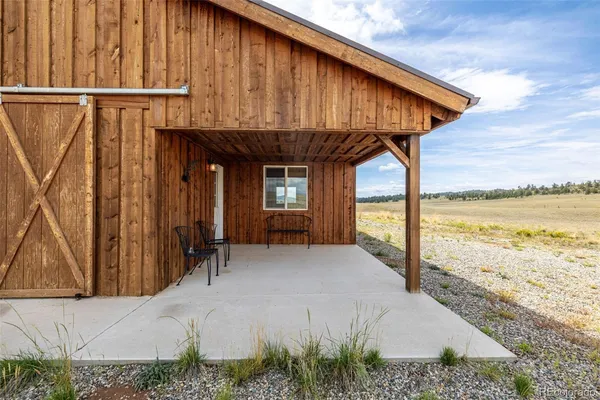 a view of swimming pool with outdoor seating