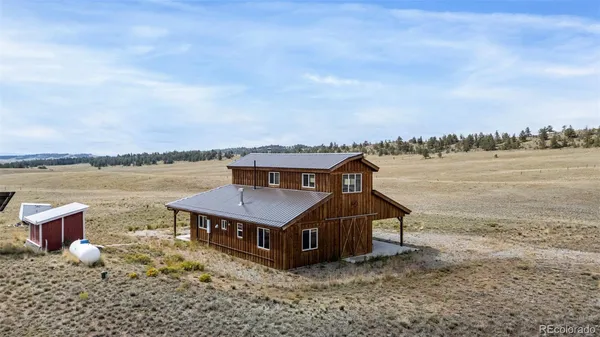 a aerial view of a house with a ocean view