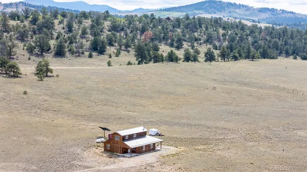 a view of a dry yard with mountain