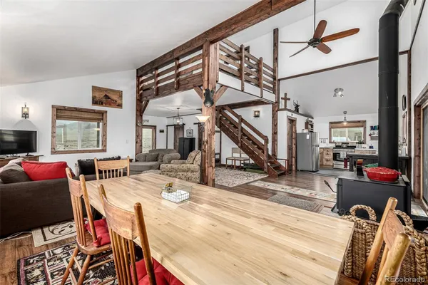 a view of a livingroom with furniture wooden floor and a rug
