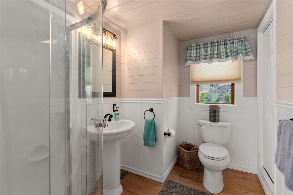33 Pine Tree Drive Holland, MA 01521 - Photo 14 of 30 a bathroom with a toilet sink and mirror