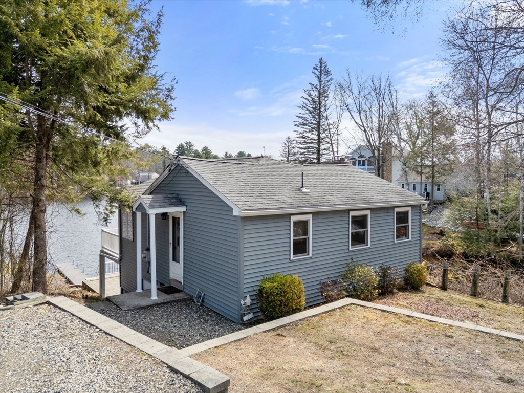 33 Pine Tree Drive Holland, MA 01521 - Photo 2 of 30 a front view of a house with a garden