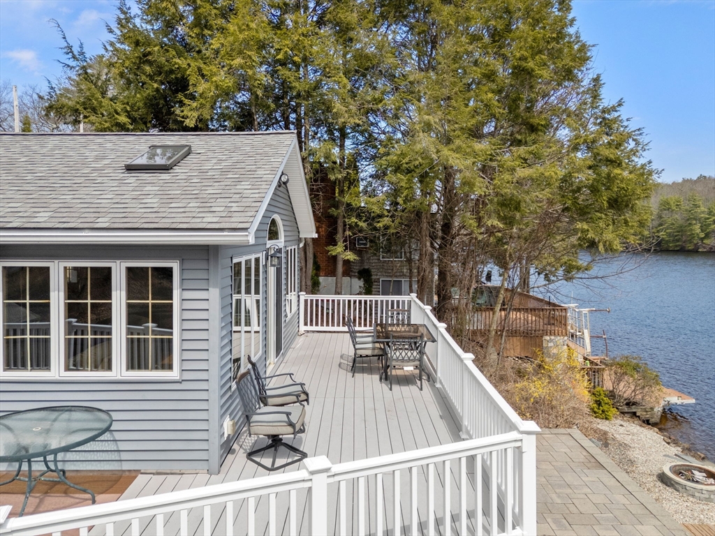 33 Pine Tree Drive Holland, MA 01521 - Photo 22 of 30 a view of a roof deck with couches and potted plants