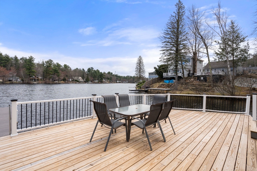 33 Pine Tree Drive Holland, MA 01521 - Photo 25 of 30 a terrace with wooden floor and outdoor seating