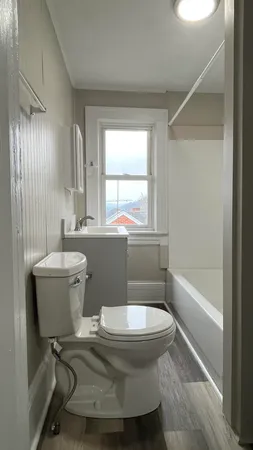 a bathroom with a toilet sink and bathtub