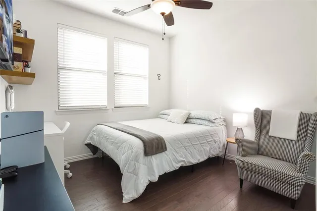 a bedroom with a bed and a couch