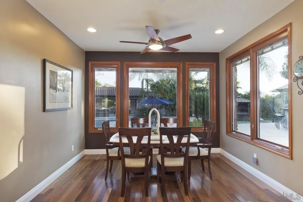 14401 Sandhill Road Poway, CA 92064 - Photo 18 of 75 a view of a dining room with furniture window and wooden floor