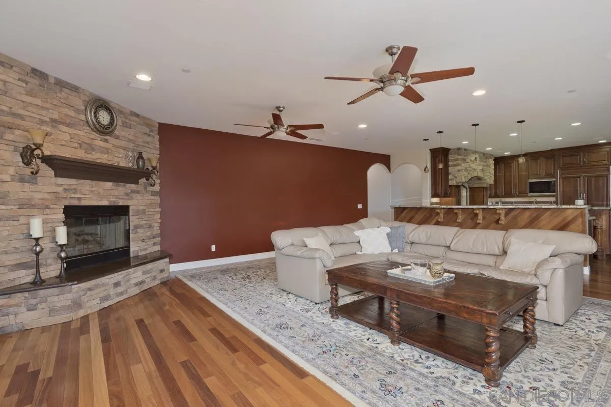 14401 Sandhill Road Poway, CA 92064 - Photo 21 of 75 a living room with furniture and a fireplace