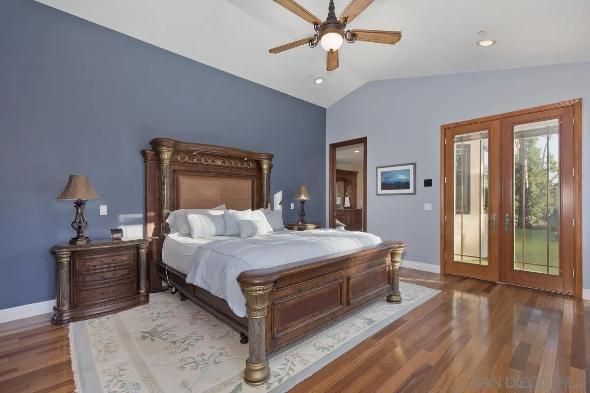 14401 Sandhill Road Poway, CA 92064 - Photo 24 of 75 a bed sitting in a spacious bedroom next to a window