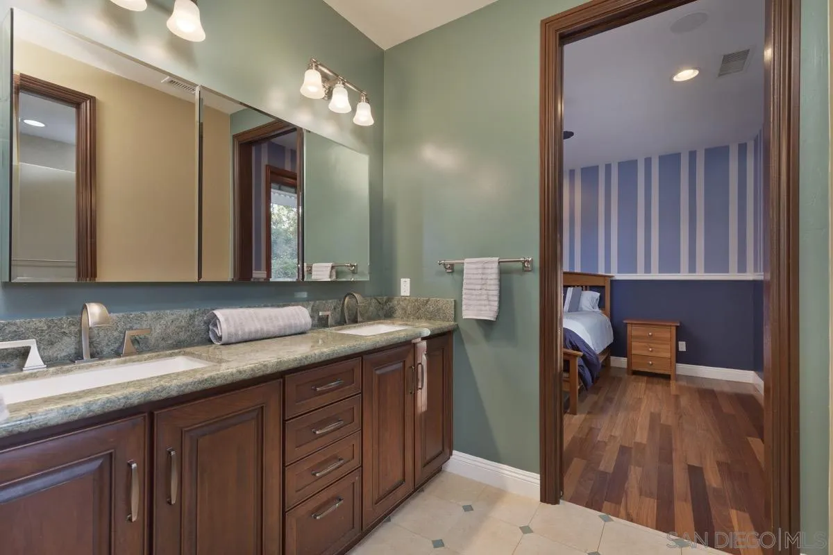 14401 Sandhill Road Poway, CA 92064 - Photo 39 of 75 a bathroom with a sink and a mirror