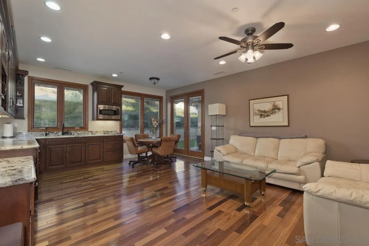 14401 Sandhill Road Poway, CA 92064 - Photo 41 of 75 a living room with furniture and a large window