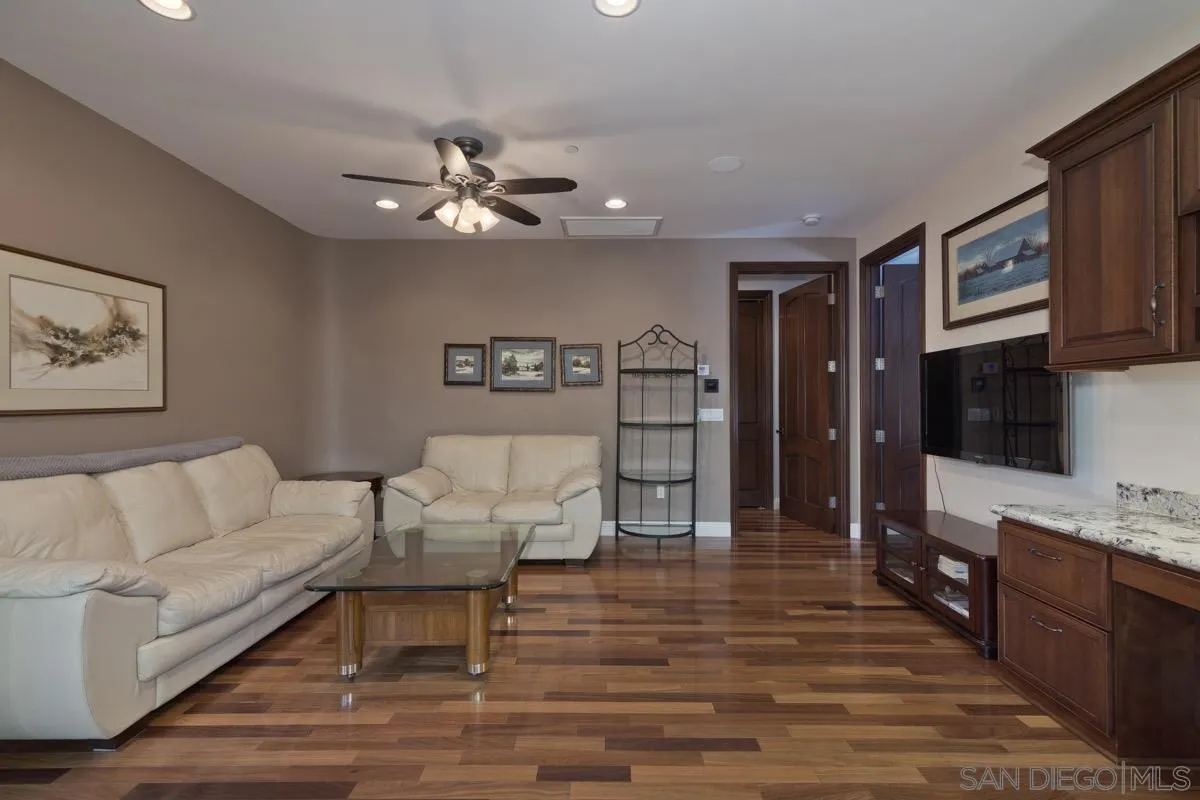 14401 Sandhill Road Poway, CA 92064 - Photo 42 of 75 a living room with furniture and a flat screen tv