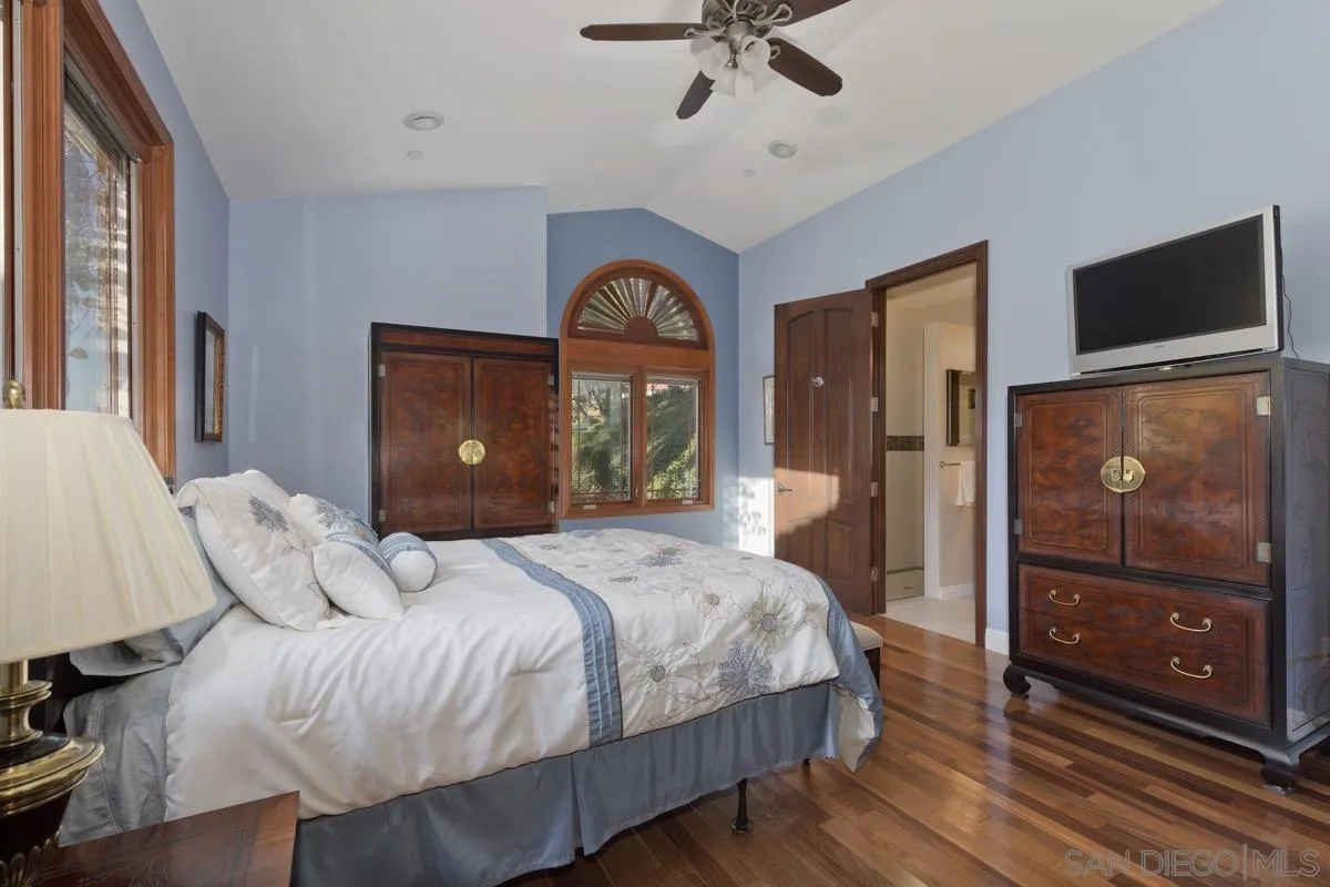 14401 Sandhill Road Poway, CA 92064 - Photo 43 of 75 a bedroom with a bed and a flat tv screen on dresser