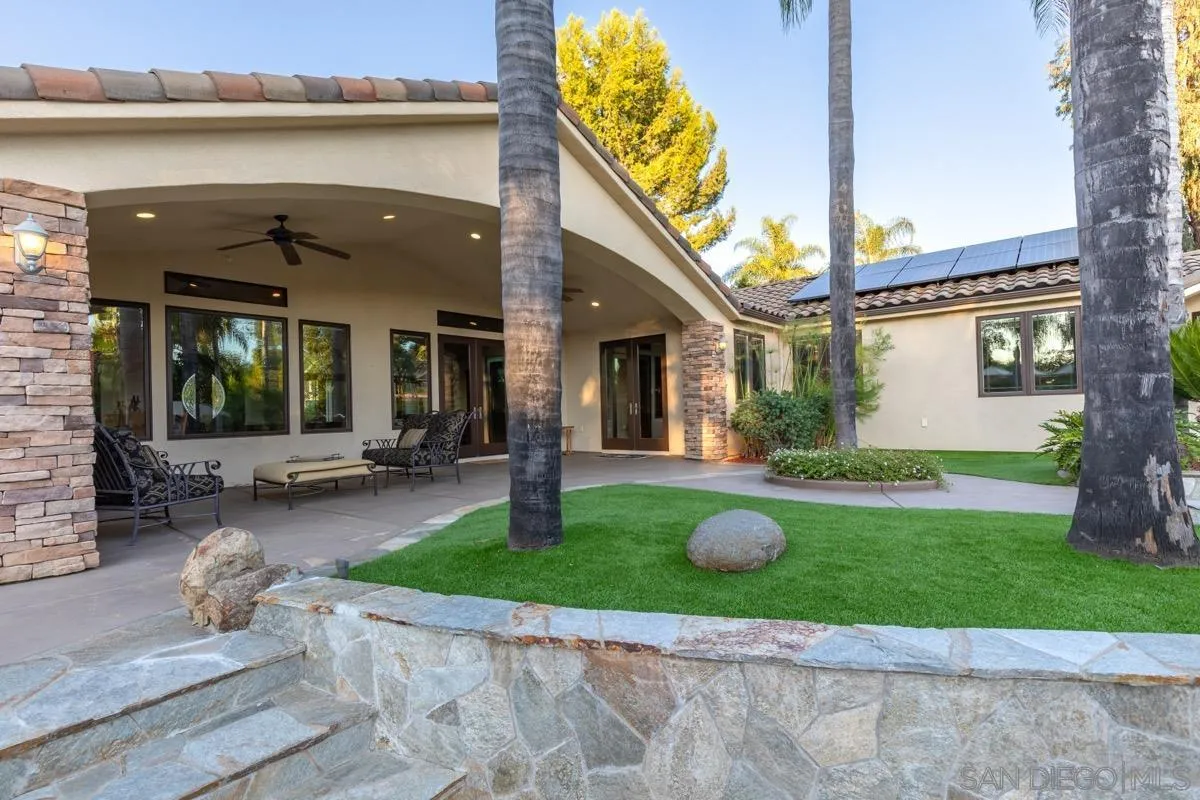 14401 Sandhill Road Poway, CA 92064 - Photo 50 of 75 a view of a house with backyard and porch