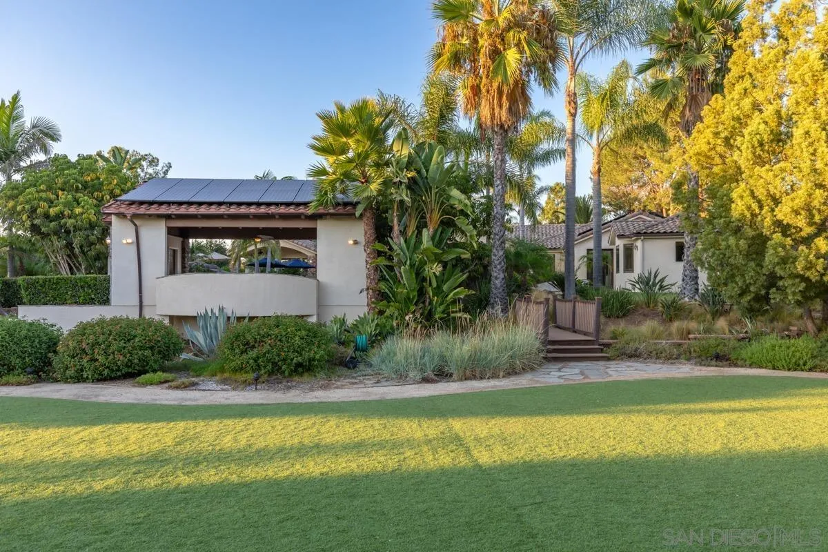 14401 Sandhill Road Poway, CA 92064 - Photo 57 of 75 a front view of a house with a yard and swimming pool