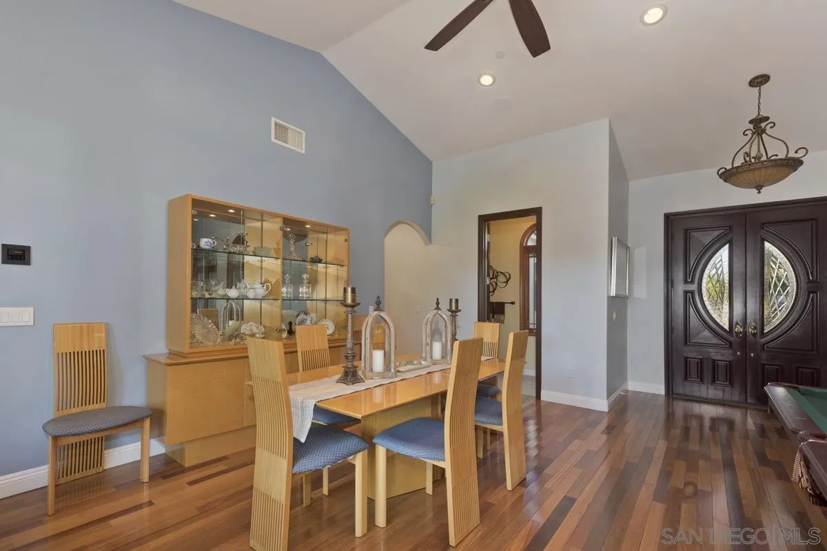 14401 Sandhill Road Poway, CA 92064 - Photo 10 of 75 a dining room with furniture and wooden floor