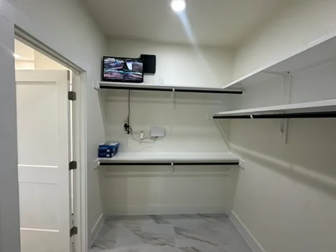 a view of an empty walk in closet