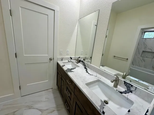 a bathroom with a sink and a mirror