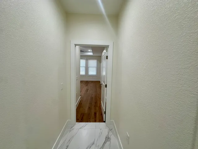 a kitchen with stainless steel appliances granite countertop a stove and a refrigerator
