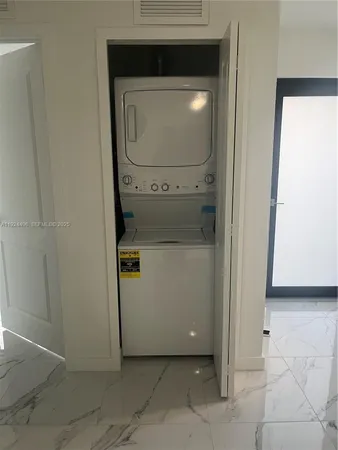 a utility room with washer and dryer