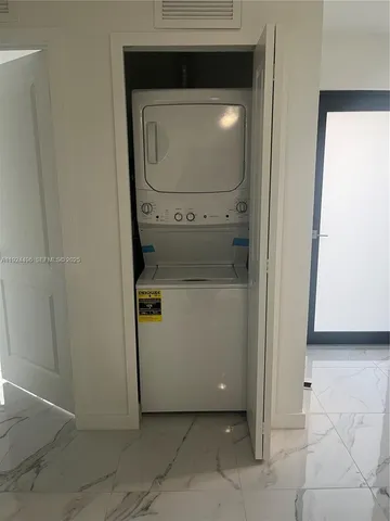 a utility room with washer and dryer