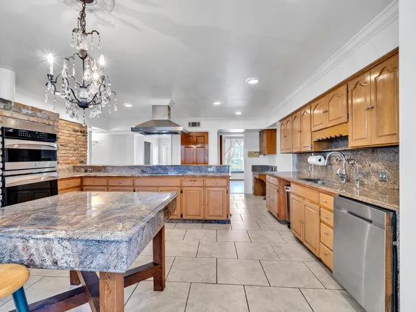a bathroom with a sink a vanity and mirror