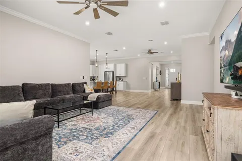 a bedroom with a bed and a flat screen television