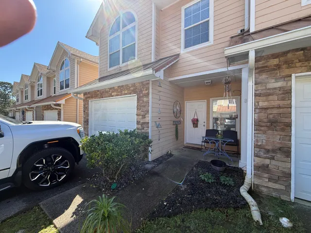 a view of a car is parked in front of a building