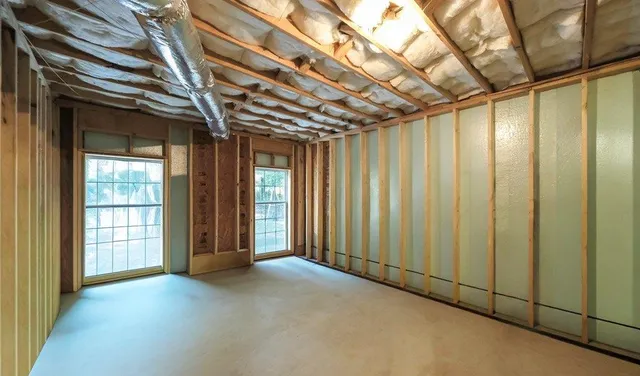 a view of balcony with wooden floor and fence