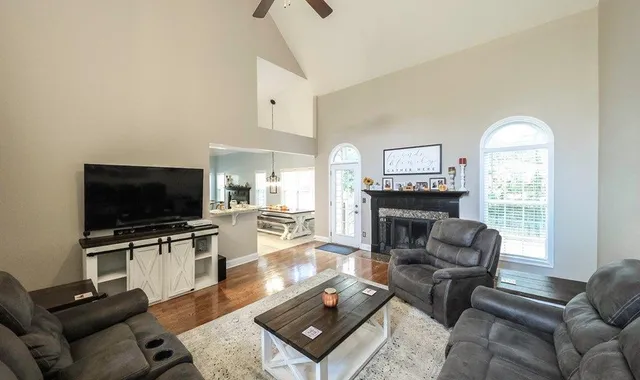 a living room with furniture and a flat screen tv