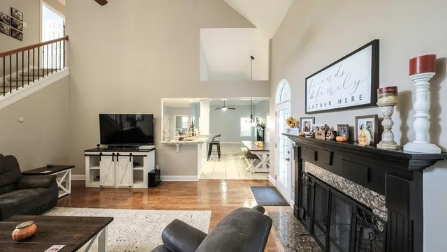a living room with furniture and a flat screen tv