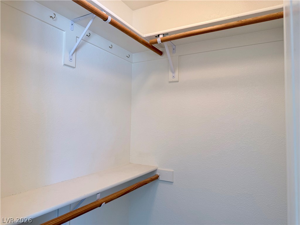 1220 East Gamebird Road Pahrump, NV 89048 - Photo 18 of 49 Ample storage solutions await within this well-appointed, naturally illuminated walk-in closet.