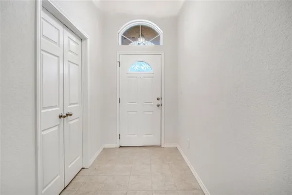 an empty room with window wooden floor and windows
