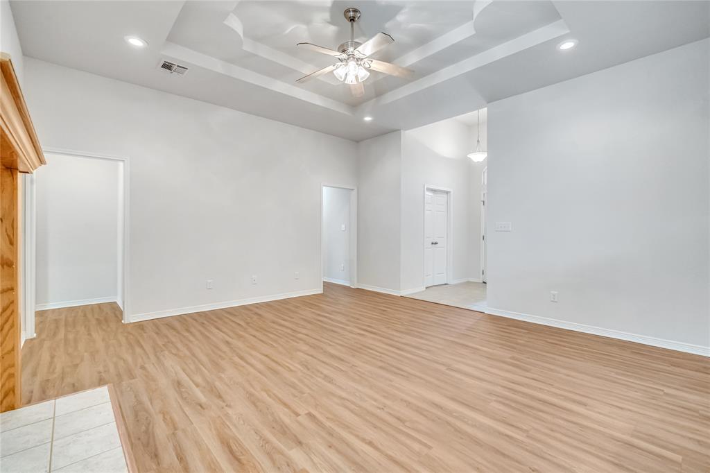 5209 Foxhill Road Temple, TX 76502 - Photo 6 of 14 an empty room with wooden floor and fan
