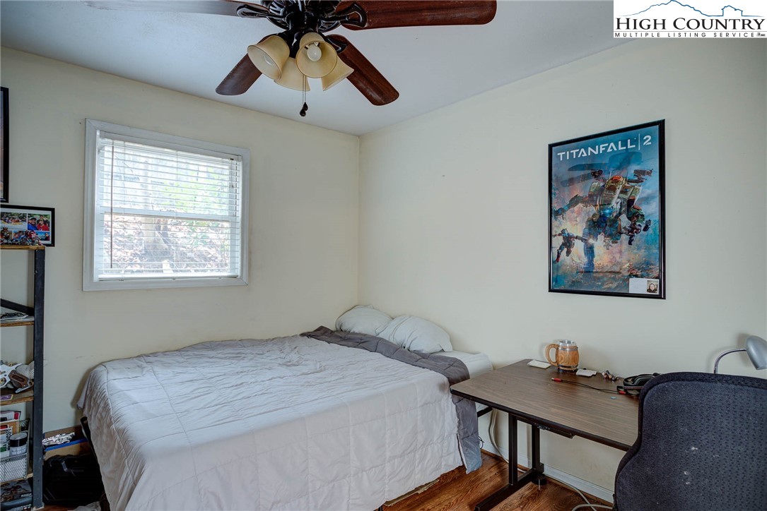 286 Faculty Street, Unit 102 Boone, NC 28607 - Photo 6 of 8 a bedroom with a bed and a desk