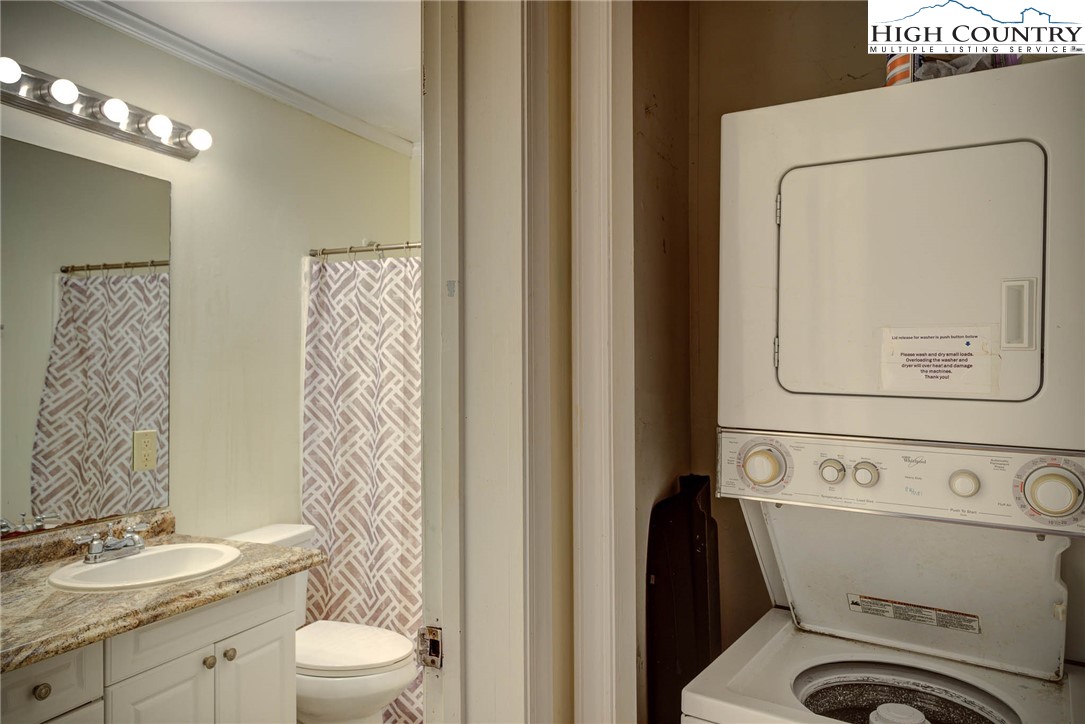 286 Faculty Street, Unit 102 Boone, NC 28607 - Photo 7 of 8 a white toilet sitting next to a bathroom sink