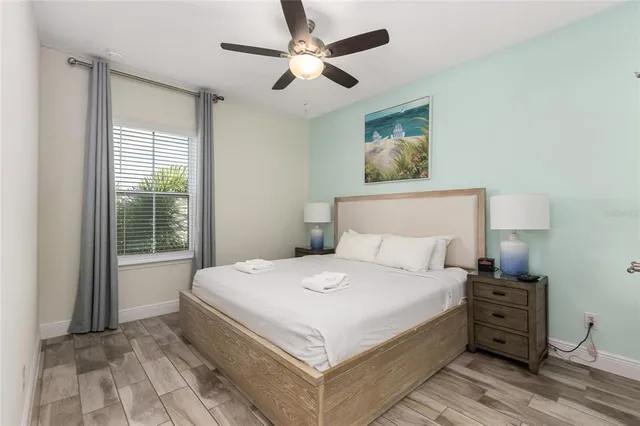 a bedroom with a large bed and a window