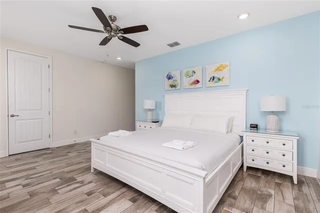 a bathroom with a double vanity sink toilet and shower