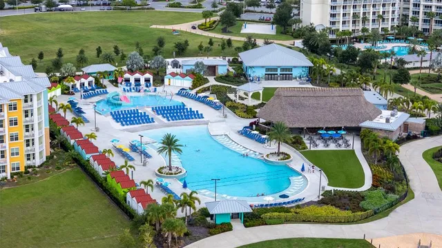 an aerial view of a house with a lake view
